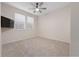 Spacious bedroom with wall-mounted TV and window blinds at 4859 Nw 35Th Lane Rd, Ocala, FL 34482