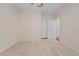 Well-lit bedroom with carpeted floors and access to a closet at 4859 Nw 35Th Lane Rd, Ocala, FL 34482
