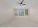 Bright bedroom featuring neutral walls and plush carpeting at 4859 Nw 35Th Lane Rd, Ocala, FL 34482