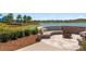 Brick fire pit with seating area overlooking the lake at 4859 Nw 35Th Lane Rd, Ocala, FL 34482