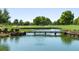 Peaceful golf course with a bridge over a pond at 4859 Nw 35Th Lane Rd, Ocala, FL 34482