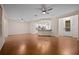 Open living room with hardwood floors and kitchen island at 4859 Nw 35Th Lane Rd, Ocala, FL 34482