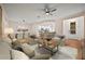 Open living room features hardwood floors, ceiling fan and neutral color palette at 4859 Nw 35Th Lane Rd, Ocala, FL 34482