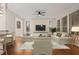 Relaxing living room with hardwood floors, large TV and comfortable seating at 4859 Nw 35Th Lane Rd, Ocala, FL 34482