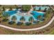 Aerial view of resort-style pool with palm trees and lounge chairs at 4859 Nw 35Th Lane Rd, Ocala, FL 34482