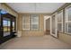 Sunroom with access to backyard and neutral flooring at 4859 Nw 35Th Lane Rd, Ocala, FL 34482