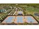 Aerial view of tennis courts and a community clubhouse at 4859 Nw 35Th Lane Rd, Ocala, FL 34482