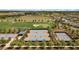 Aerial view of tennis courts near a golf course at 4859 Nw 35Th Lane Rd, Ocala, FL 34482
