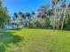 Large grassy backyard with mature trees and privacy at 544 Stone Island Rd, Enterprise, FL 32725