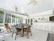 Sunroom features seating, dining area, and a wet bar at 544 Stone Island Rd, Enterprise, FL 32725