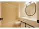 Clean bathroom, featuring a bathtub, toilet and vanity with an oval mirror at 665 Brightview Dr, Lake Mary, FL 32746