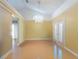 Bright dining room with hardwood floors and a crystal chandelier at 704 Barrington Cir, Winter Springs, FL 32708