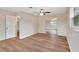 Well-lit bedroom with mirrored closet doors at 900 Crescent Pkwy, Deland, FL 32724