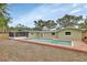 House exterior with pool and screened porch at 900 Crescent Pkwy, Deland, FL 32724