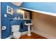 Small bathroom with pedestal sink and blue walls at 101 Fleming Ave, Port Orange, FL 32127