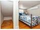 Small bedroom with a comfortable bed and hardwood floors at 101 Fleming Ave, Port Orange, FL 32127