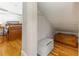 Small attic closet with wood floors at 101 Fleming Ave, Port Orange, FL 32127