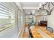 Elegant dining room with a farmhouse table and water views at 101 Fleming Ave, Port Orange, FL 32127