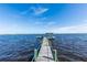 Wooden dock extending into the water with a gazebo at 101 Fleming Ave, Port Orange, FL 32127