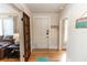 Bright entryway with hardwood floors and a charming front door at 101 Fleming Ave, Port Orange, FL 32127