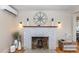 Whitewashed brick fireplace with a nautical-themed mantel at 101 Fleming Ave, Port Orange, FL 32127