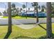 White hammock between palm trees in a grassy yard at 101 Fleming Ave, Port Orange, FL 32127