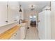 Bright kitchen with butcher block countertops and white cabinets at 101 Fleming Ave, Port Orange, FL 32127