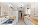 Galley kitchen with wood countertops and white cabinets at 101 Fleming Ave, Port Orange, FL 32127