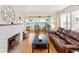 Relaxing living room with a fireplace and water views at 101 Fleming Ave, Port Orange, FL 32127