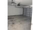 Attached garage with automatic opener and ceiling fan at 1201 Buccaneer Ave, Deltona, FL 32725