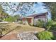 House exterior with stone and wood siding at 1250 Baton Dr, Deltona, FL 32725