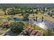 An aerial view of a condo situated by a lake and golf course at 156 Black Duck Cir, Daytona Beach, FL 32119