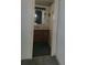 Small bathroom with wood vanity and green carpet at 1632 Bream Dr, Seville, FL 32190