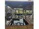 Covered boat dock with lift on the water at 1632 Bream Dr, Seville, FL 32190