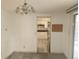 Dining area with carpet flooring and a chandelier at 1632 Bream Dr, Seville, FL 32190