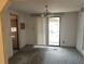 Simple dining room with carpet, sliding doors to patio at 1632 Bream Dr, Seville, FL 32190