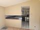 Galley kitchen with white cabinets and stainless steel appliances at 1632 Bream Dr, Seville, FL 32190