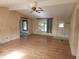 Living room with light wood floors and a ceiling fan at 1632 Bream Dr, Seville, FL 32190
