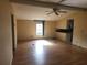 Open living and kitchen area with laminate floors at 1632 Bream Dr, Seville, FL 32190