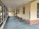 Spacious screened porch with light brick and siding at 1632 Bream Dr, Seville, FL 32190