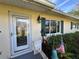 Charming house exterior with green shutters and landscaping at 1881 Riveredge Dr, Astor, FL 32102