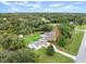 Aerial view of a single Gathering home, spacious yard, and detached building at 2 Walnut Ct, Ormond Beach, FL 32174
