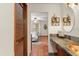 Bathroom with copper vessel sink and view into bedroom at 2 Walnut Ct, Ormond Beach, FL 32174