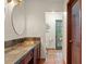 Bathroom with copper sink, slate tile, and access to backyard at 2 Walnut Ct, Ormond Beach, FL 32174