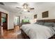 Main bedroom with ceiling fan and large aquarium at 2 Walnut Ct, Ormond Beach, FL 32174