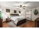 Spacious bedroom with ceiling fan and wood furniture at 2 Walnut Ct, Ormond Beach, FL 32174