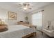 Bedroom with queen bed, chair, and large window at 2 Walnut Ct, Ormond Beach, FL 32174