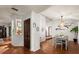 Open dining room with hardwood floors and adjacent kitchen at 2 Walnut Ct, Ormond Beach, FL 32174