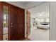 Entryway with a dark wooden door opening to a bedroom at 2 Walnut Ct, Ormond Beach, FL 32174