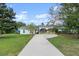 House with carport and nicely landscaped front yard at 2 Walnut Ct, Ormond Beach, FL 32174